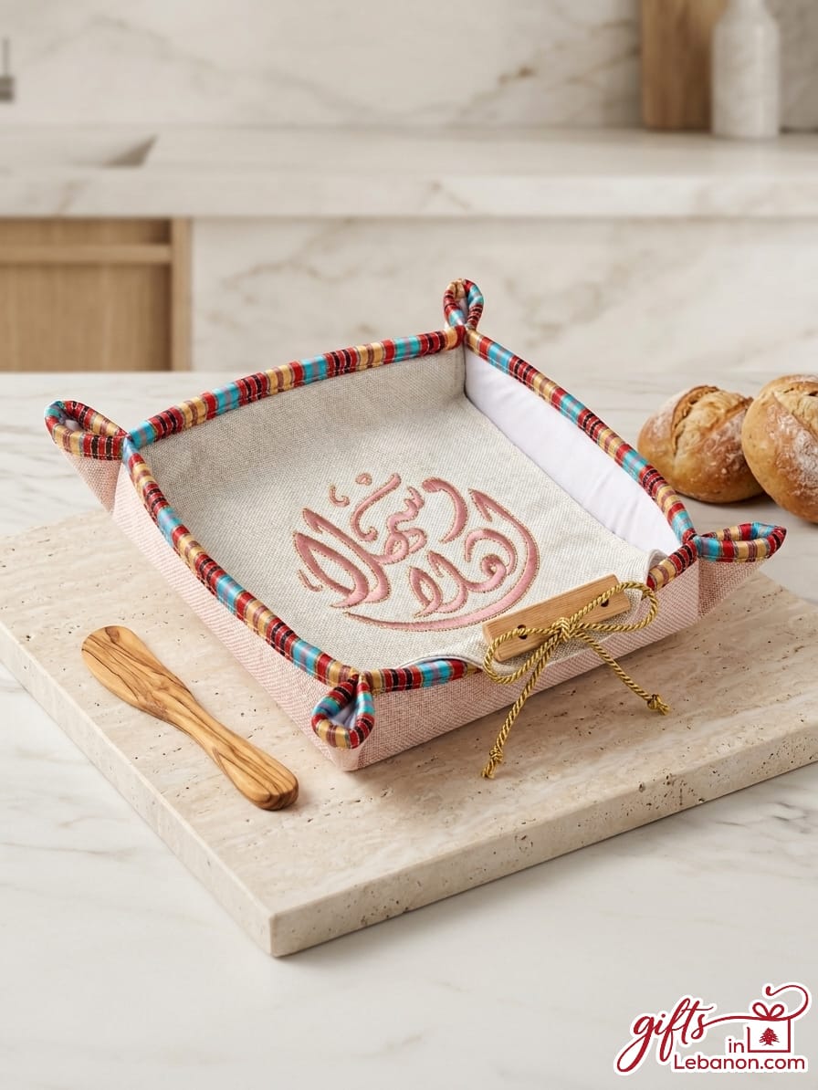 Embroidered Ahlan Wa Sahlan fabric bread basket with traditional trim and wooden spreader