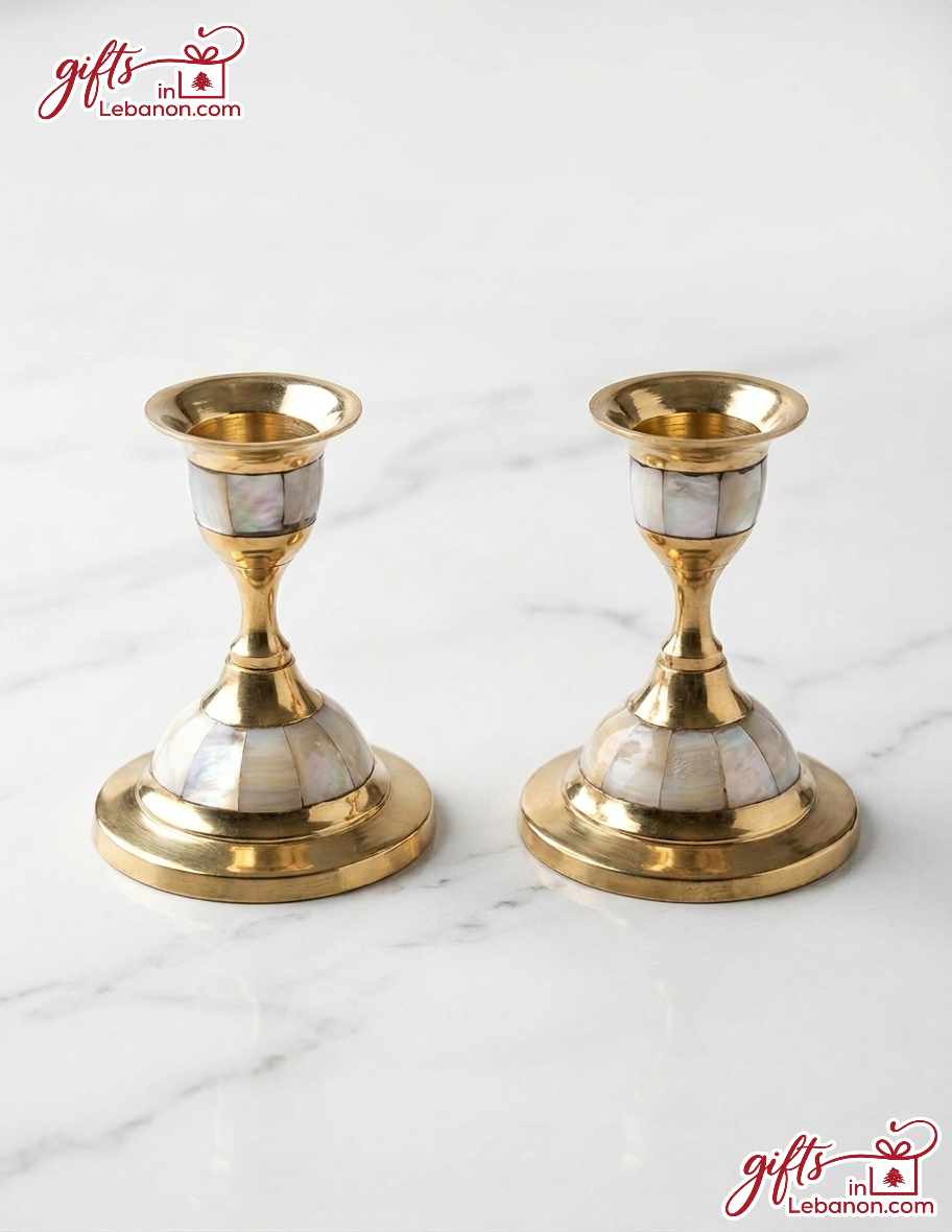 A pair of traditional handcrafted brass candlesticks with mother-of-pearl inlay