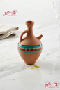 Hand-painted traditional Lebanese clay Ibrik pitcher on a marble countertop