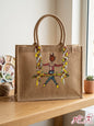 Hand-painted jute tote bag featuring a girl on a swing