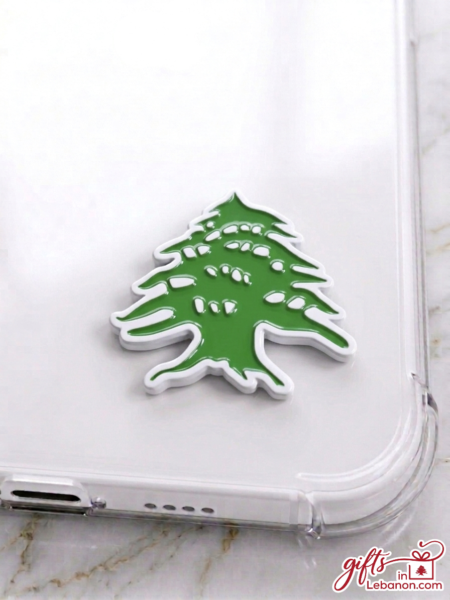 Premium green and white Lebanese Cedar enamel sticker on a clear phone case