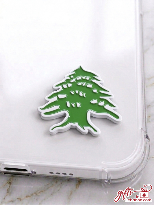 Premium green and white Lebanese Cedar enamel sticker on a clear phone case