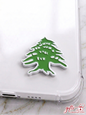 Premium green and white Lebanese Cedar enamel sticker on a clear phone case