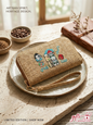 Handcrafted embroidered clutch wallet featuring a traditional Lebanese house and coffee design