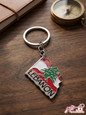 Premium metal keychain shaped like the map of Lebanon with the Lebanese flag and Cedar tree