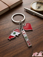 Premium Lebanon map and red heart charm keychain on a wooden background
