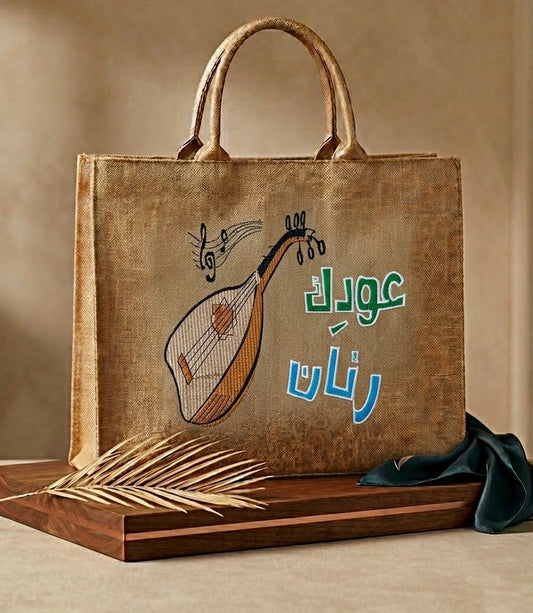 Oudak Rannan embroidered jute tote bag with Oud illustration