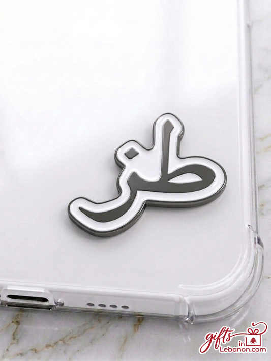 Premium Toz Arabic enamel sticker on a clear phone case
